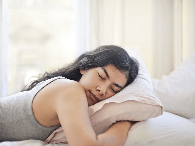 A woman sleeping in bed