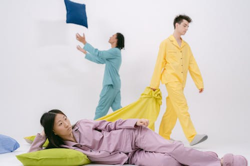 people in pyjamas struggling to sleep