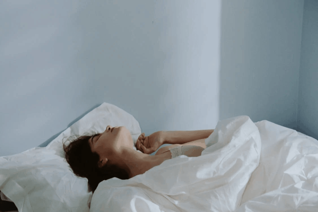 Woman sleeping in her bed 
