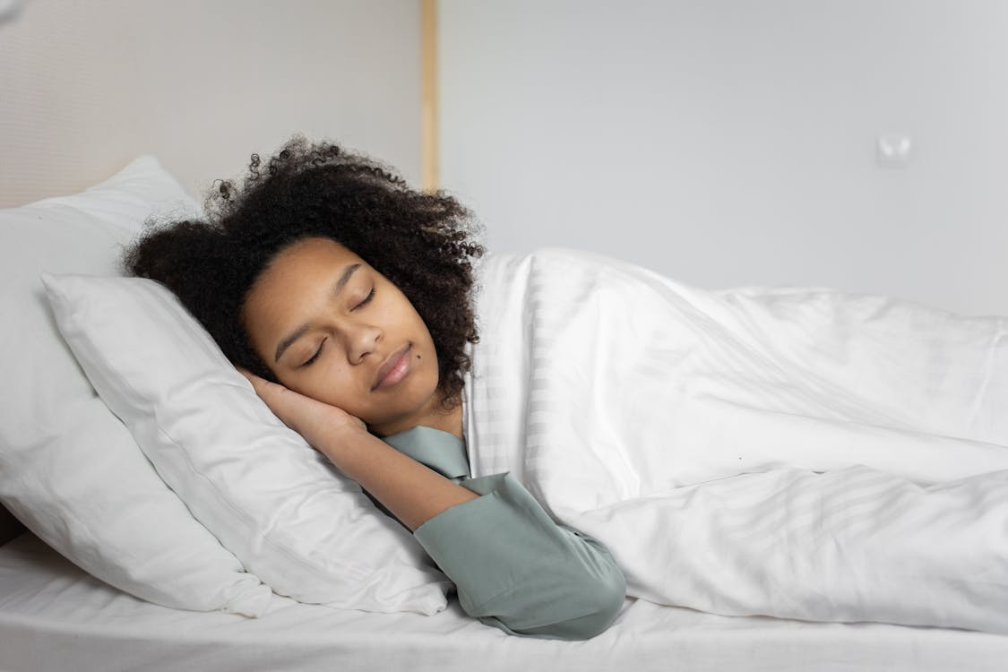 A woman sleeping in bed