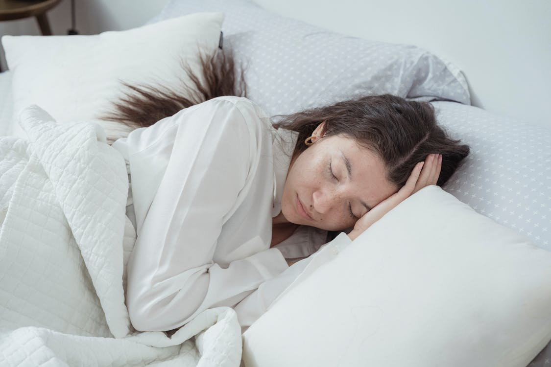 A woman sleeping in bed