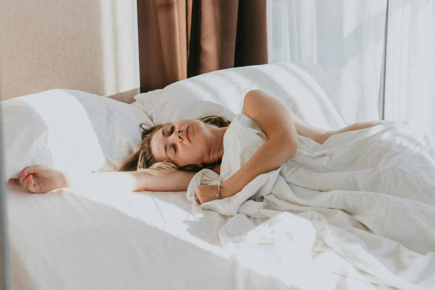 A woman sleeping in bed
