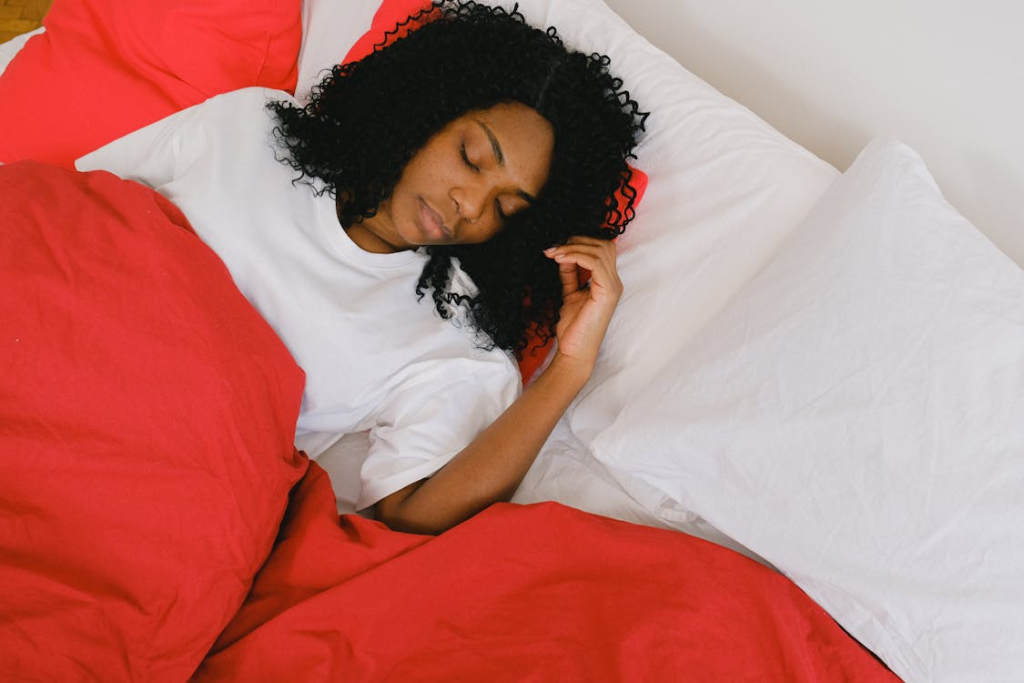 Individual sleeping comfortably in bed while contributing data to a remote sleep research and monitoring program.