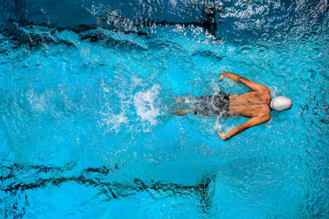 An athlete swimming in a pool