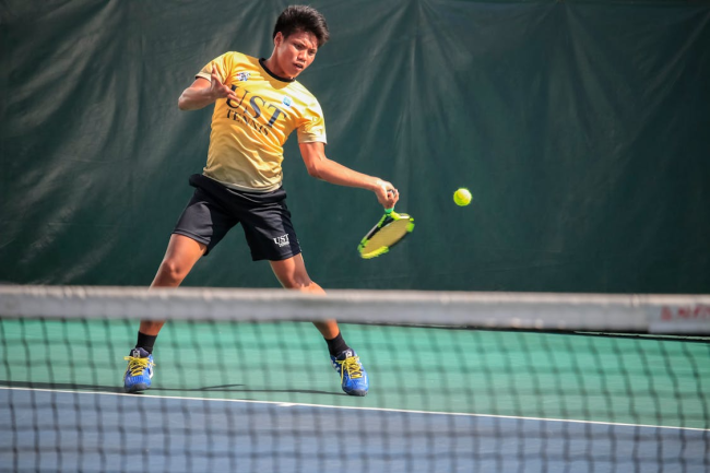 A man playing tennis